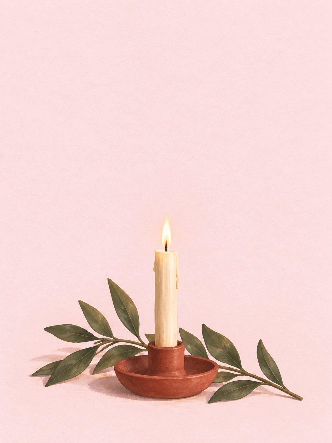 An ivory candle in a muted red holder beside an olive branch on blush paper.