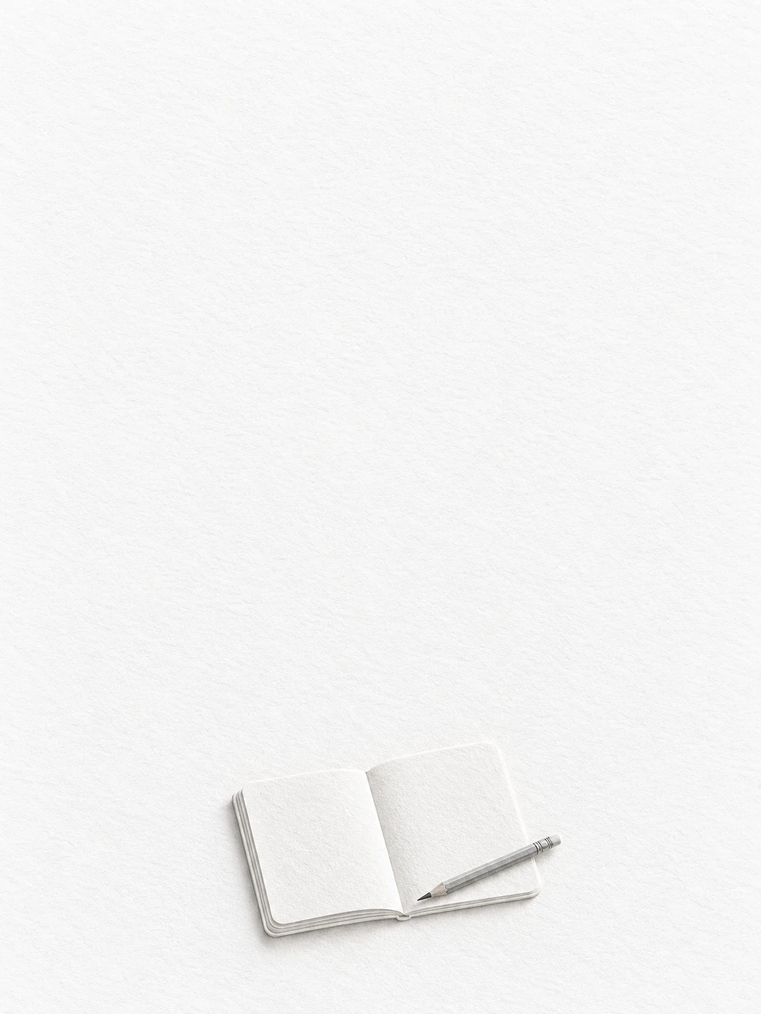 An open notebook with blank pages and a slim pencil, impressed into warm white paper.