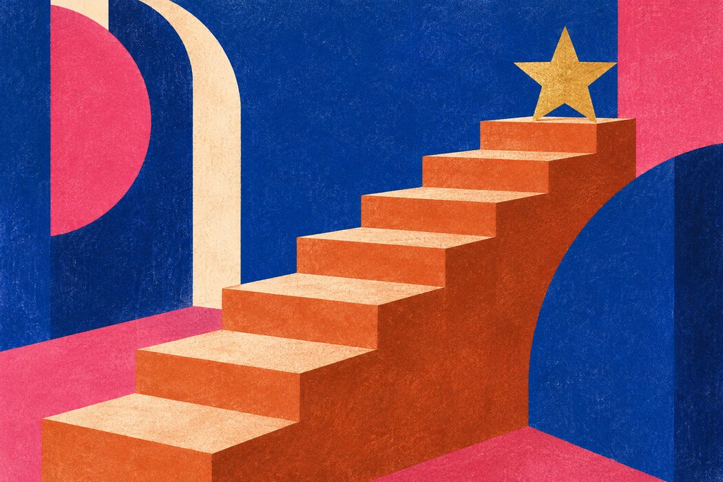 A golden star at the top of colorful printed steps.
